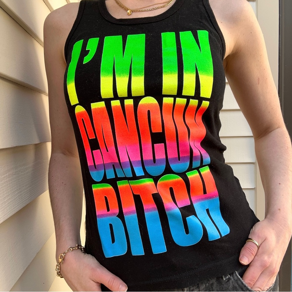 “I’M IN CANCUN BITCH” black cotton tank top with neon lettering